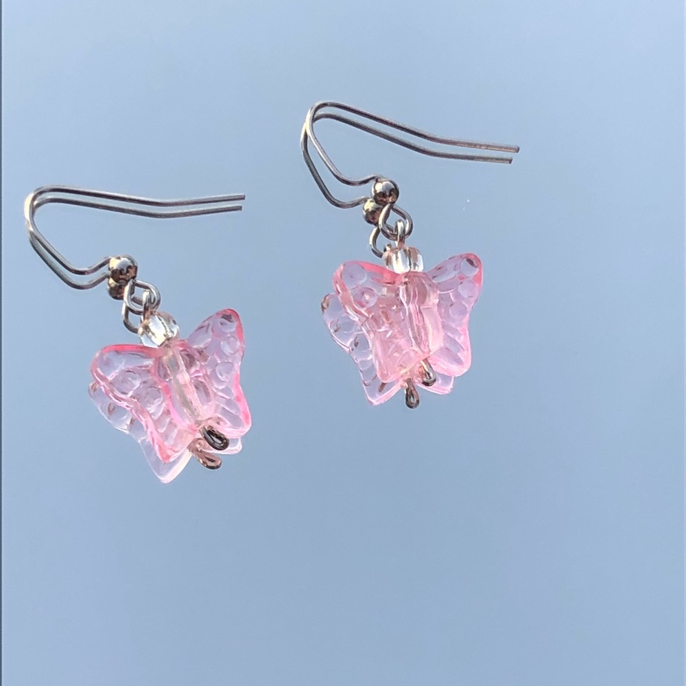 Pink tinted butterfly earrings